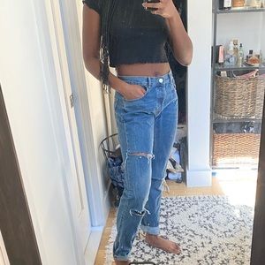 Ripped denim jeans with button up detail